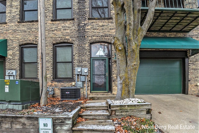 doorway to property featuring central AC