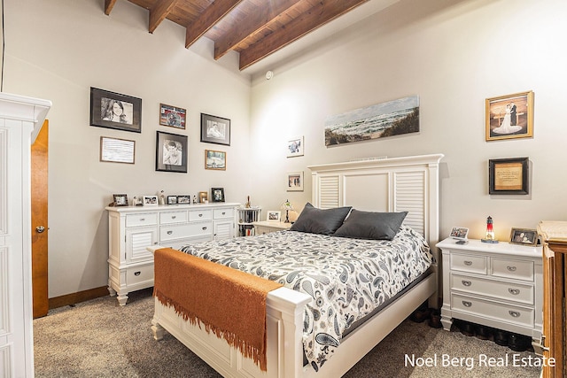 carpeted bedroom featuring beam ceiling and wood ceiling