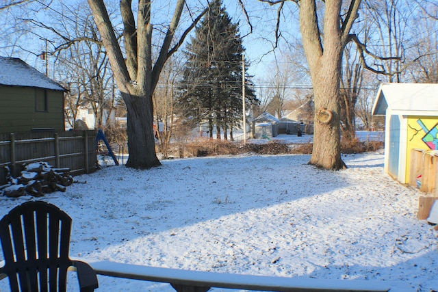 view of yard layered in snow