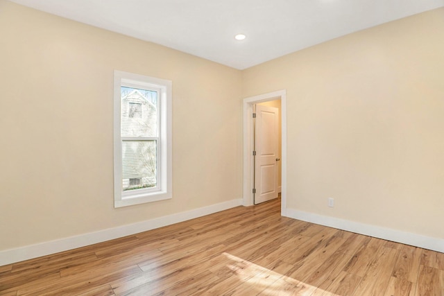 spare room featuring light hardwood / wood-style flooring