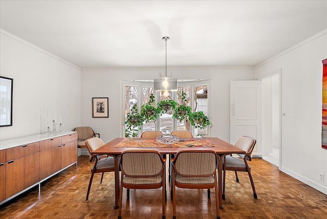 dining area with dark parquet floors and ornamental molding