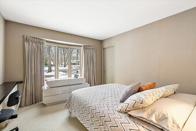 bedroom with light carpet