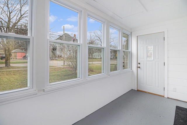 unfurnished sunroom featuring a healthy amount of sunlight