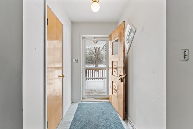 doorway to outside featuring light tile patterned floors