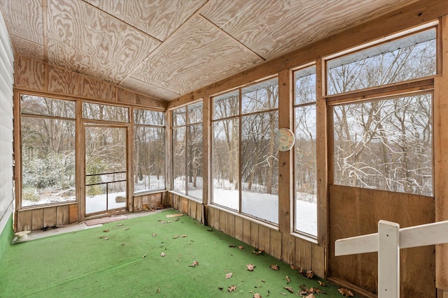 unfurnished sunroom with lofted ceiling and wooden ceiling