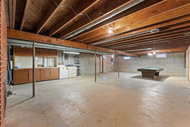 basement featuring washer and clothes dryer and pool table