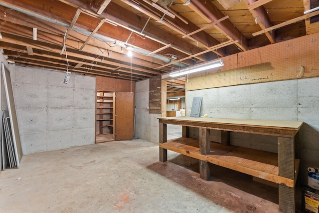 basement with a workshop area