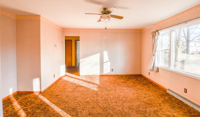 carpeted spare room with ceiling fan and baseboard heating