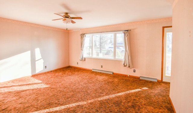 carpeted empty room featuring ceiling fan and a baseboard heating unit