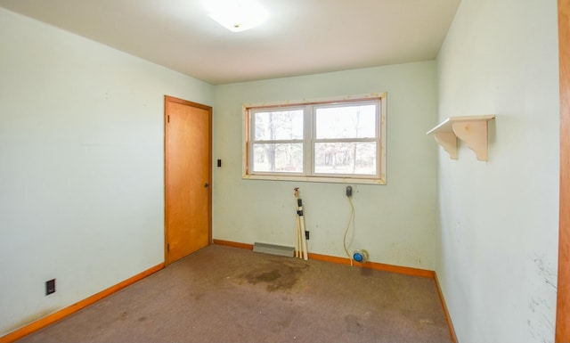 empty room featuring carpet flooring