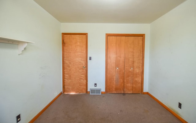 unfurnished bedroom with carpet floors