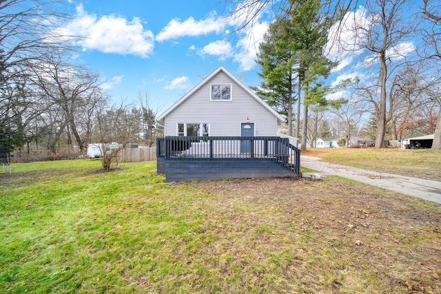 exterior space with a wooden deck and a yard