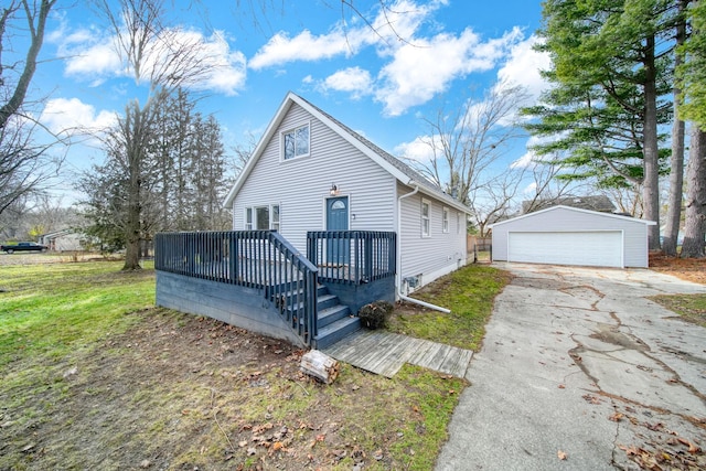 bungalow-style home featuring an outbuilding, a front yard, and a garage