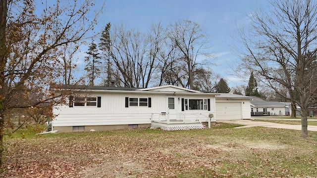 view of front of house with a front lawn and a garage