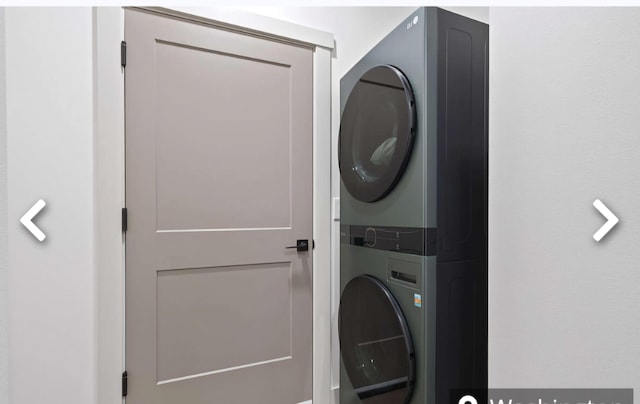 laundry room with stacked washer / dryer