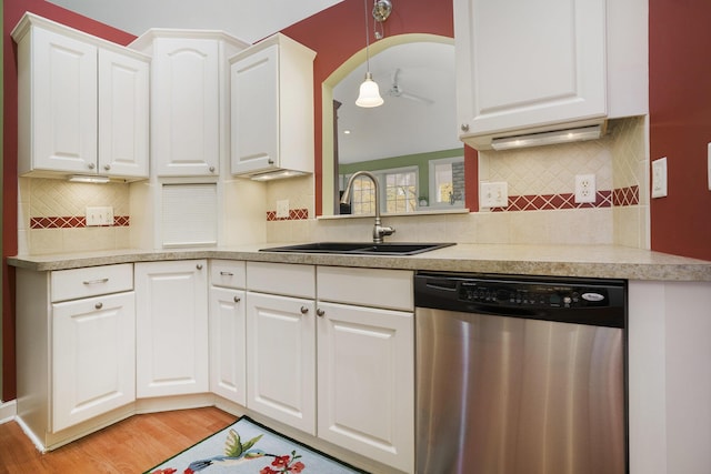 kitchen featuring ceiling fan, dishwasher, sink, light hardwood / wood-style floors, and white cabinets