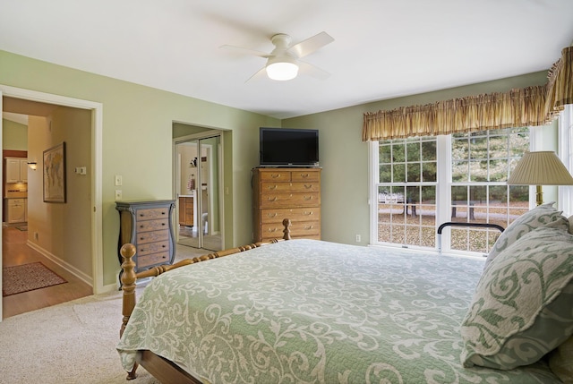 bedroom featuring ceiling fan, light wood-type flooring, and a closet