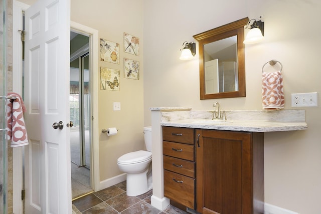 bathroom with tile patterned floors, vanity, and toilet