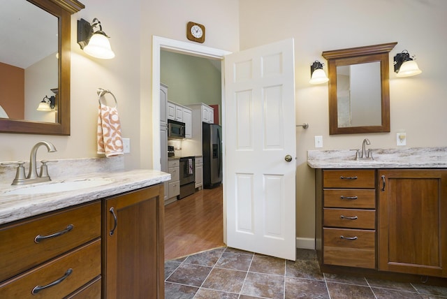 bathroom featuring vanity and hardwood / wood-style flooring