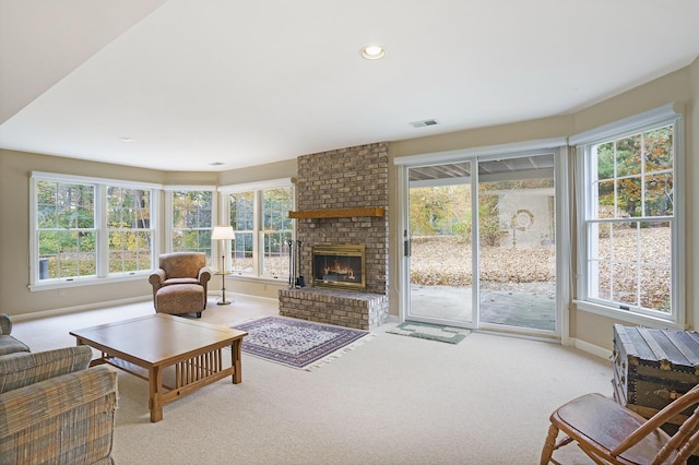 living room with a wealth of natural light and light carpet