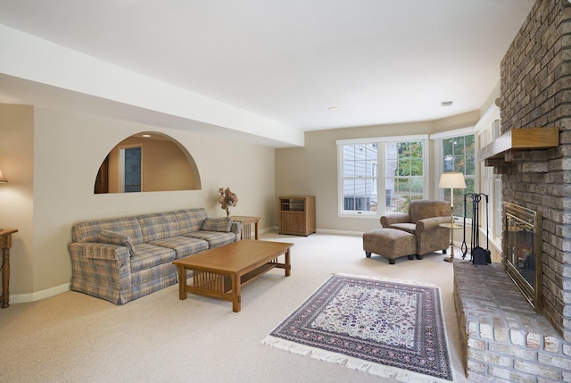 living room with carpet flooring and a fireplace