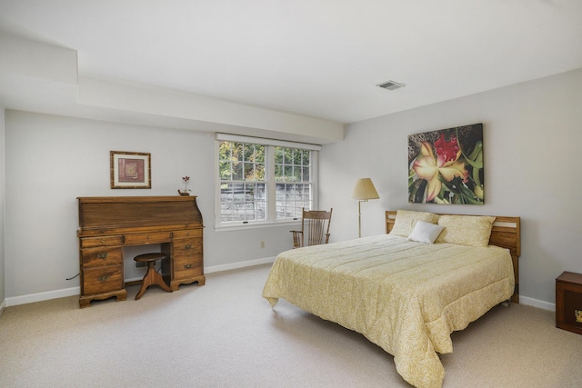 bedroom with light colored carpet