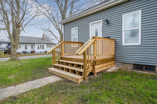 wooden terrace with a lawn