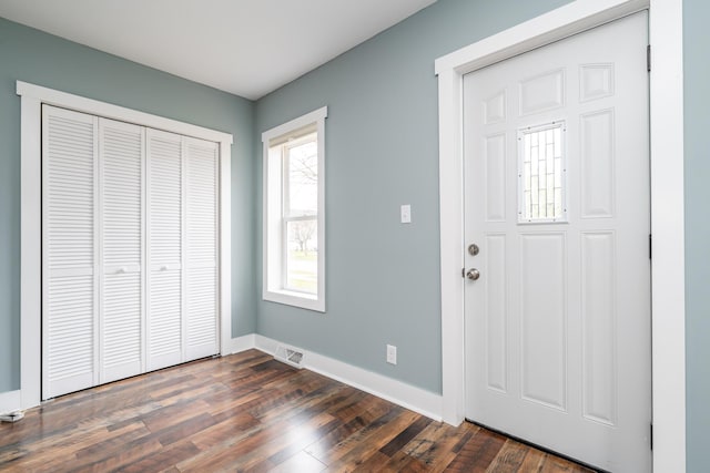 foyer with dark hardwood / wood-style floors