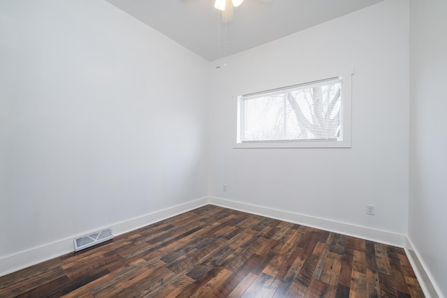 unfurnished room featuring ceiling fan and dark wood-type flooring