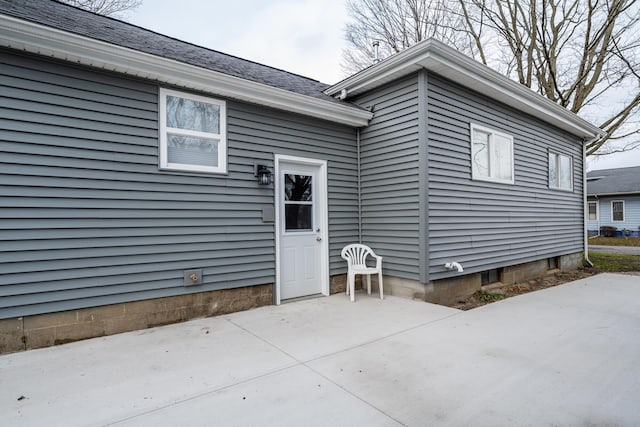 property entrance featuring a patio area