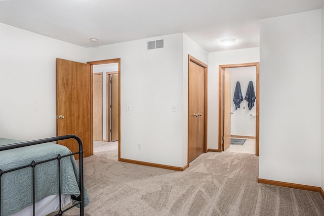 carpeted bedroom featuring a closet