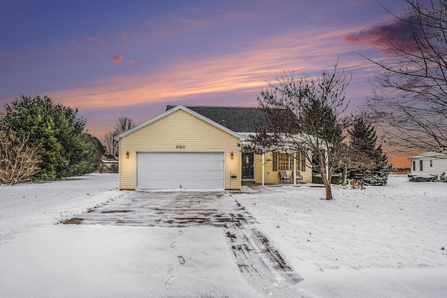 view of front of property with a garage