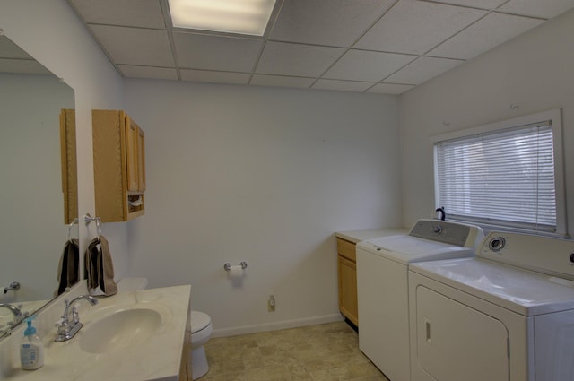 washroom featuring washer and clothes dryer and sink