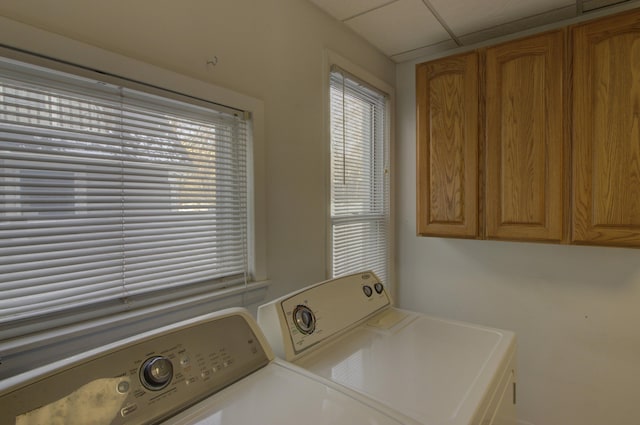 laundry area with cabinets and separate washer and dryer