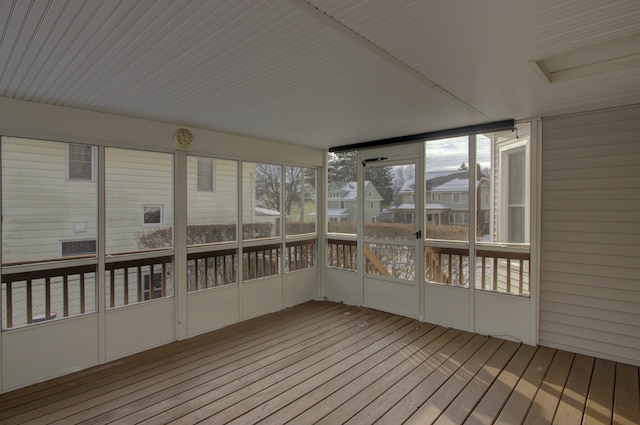 unfurnished sunroom featuring a wealth of natural light