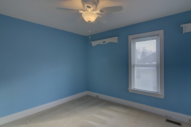 carpeted empty room with ceiling fan