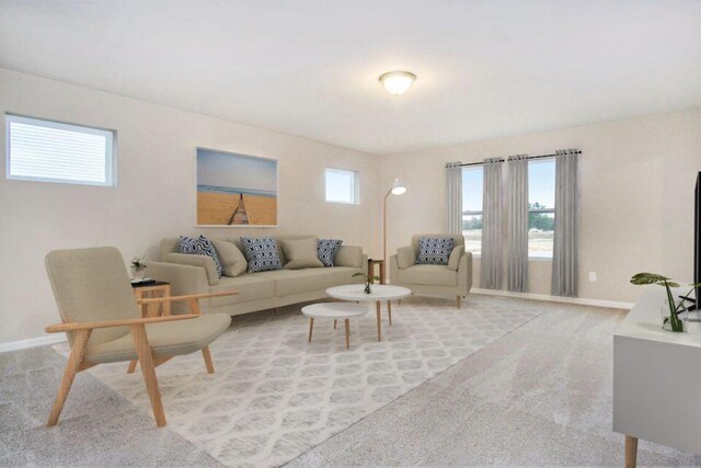 living room with carpet and baseboards