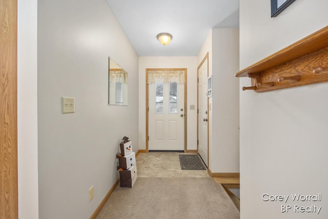 entryway with light colored carpet