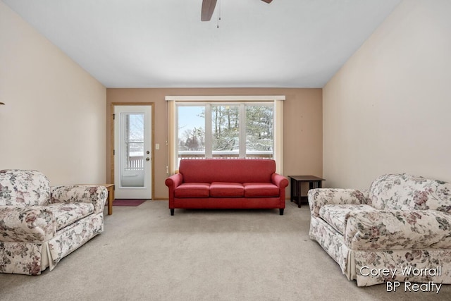 living room with carpet flooring and ceiling fan