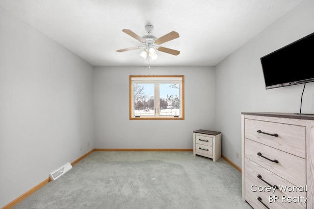 unfurnished bedroom featuring ceiling fan and light colored carpet