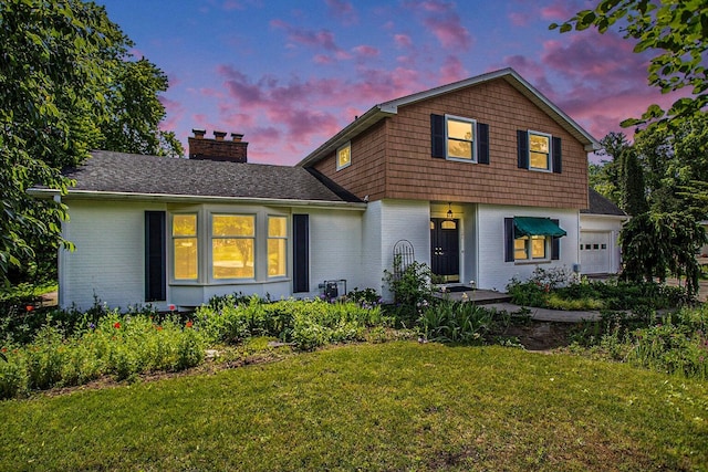 view of front of house with a yard