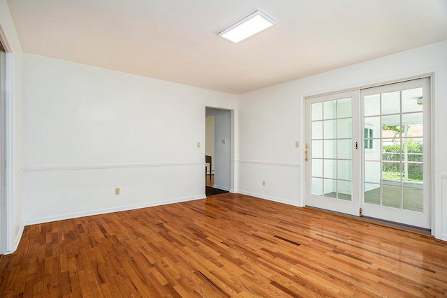 spare room featuring hardwood / wood-style floors