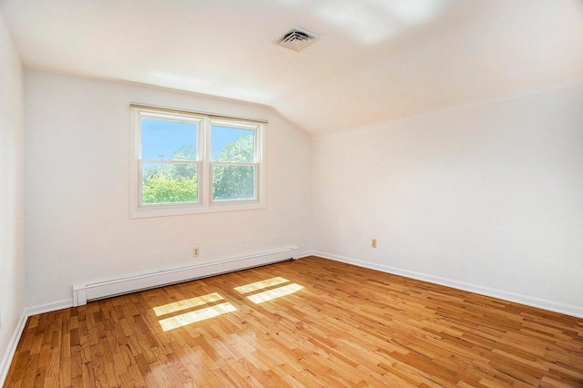 bonus room with lofted ceiling, light hardwood / wood-style flooring, and a baseboard radiator