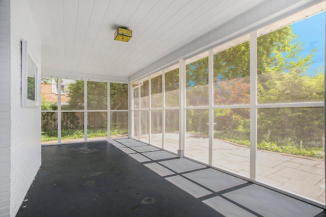 unfurnished sunroom with plenty of natural light