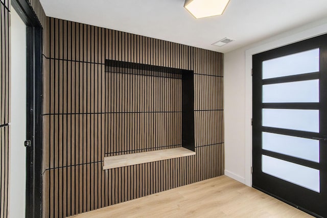 foyer entrance with light wood-type flooring