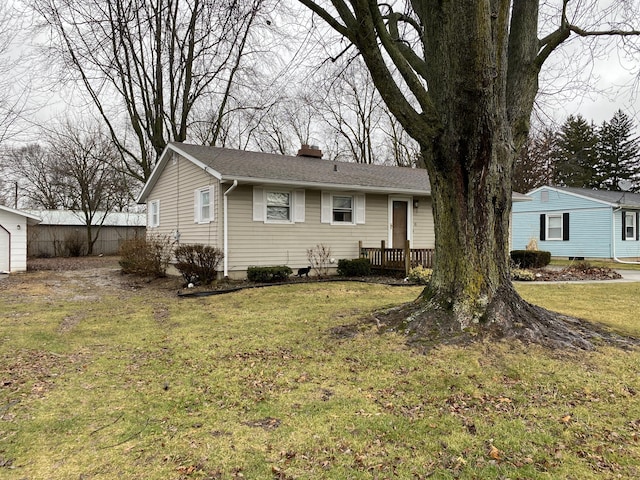 ranch-style home with a front lawn and a deck