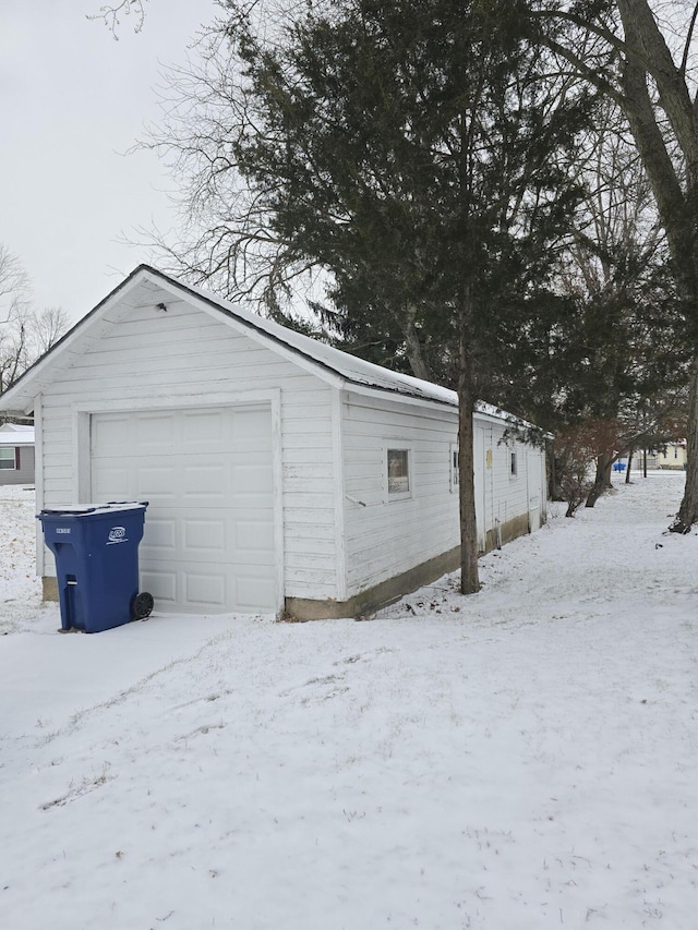 view of snow covered garage