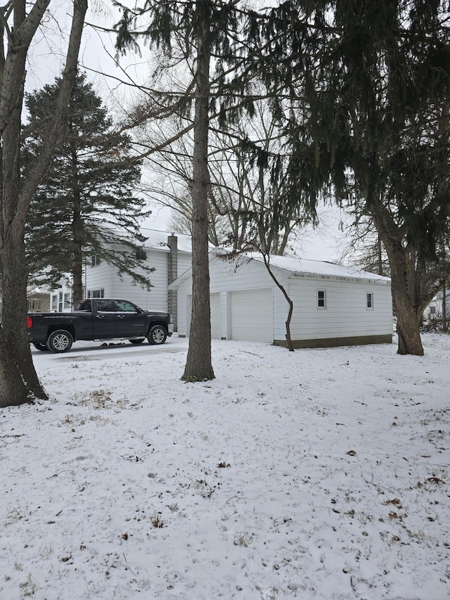 exterior space with an outdoor structure and a garage