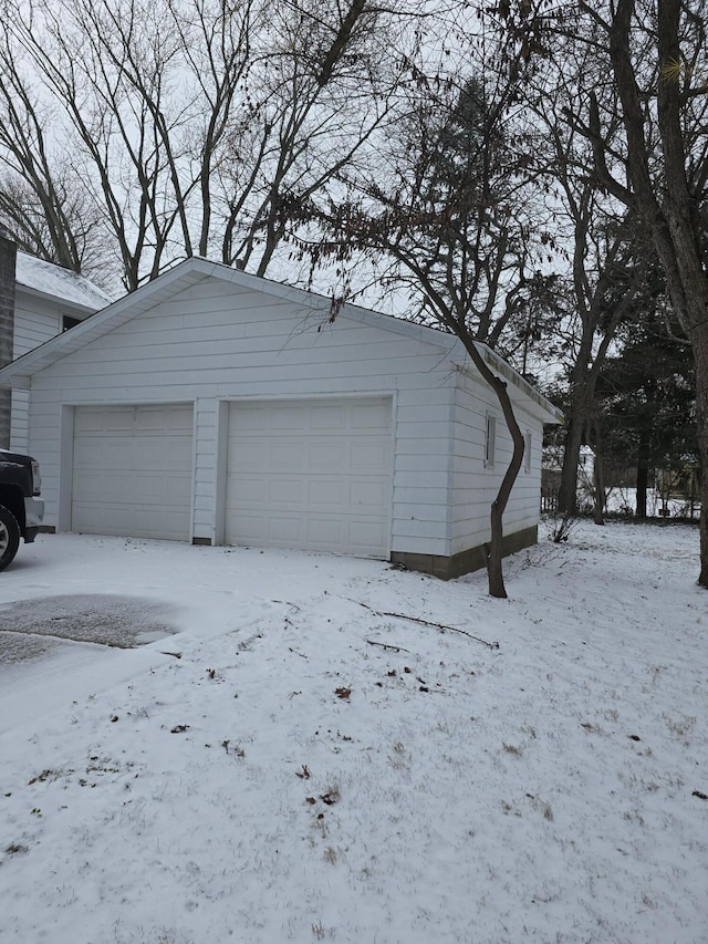 view of snow covered garage