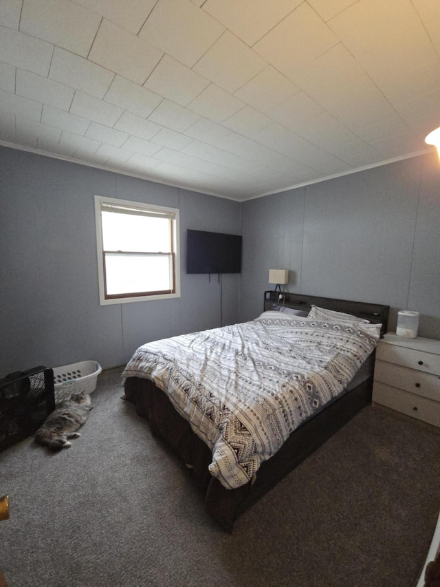 carpeted bedroom featuring crown molding